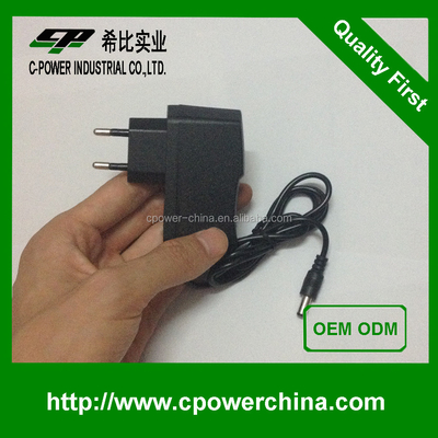 Tipo de salida de corriente continua montada en la pared de la UA 12V 1A 5V 2A 6V 2A 9V 2A Adaptador de corriente 12VDC 1A Adaptador de corriente alterna